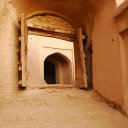 Old wooden doors guard an entrance to the old citadel of Herat