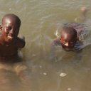 Happy-children-swimming-and-catching-small-fish