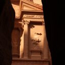 The-quintessential-shot-looking-at-the-Treasury-in-Petra-from-between-the-dark-canyon-walls