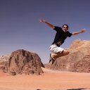 Author-jumping-high-into-the-desert-sky-Wadi-Rum