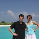 Author-and-wife-next-to-beautiful-blue-waters-of-northern-Maldives