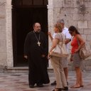 Priest-with-his-parishioners-or-perhaps-tourists