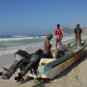 These fishermen mend their nets after a hard day of fishing off the coast of southern Oman in the Indian Ocean