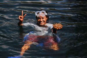 A local swimming in Palau's Jellyfish Lake