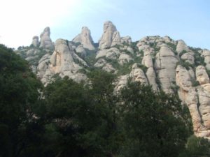 montserrat spain mountain range view with trees in foreground