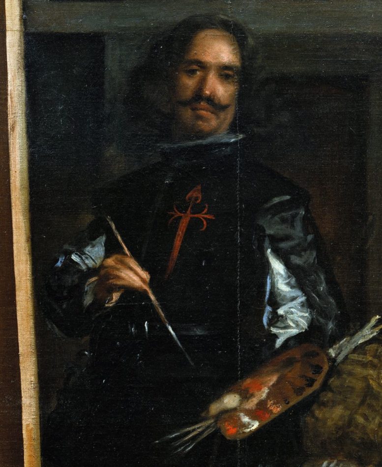 A cropped detail of Velázquez's self-portrait from Las Meninas (1656–57), showing the artist depicted in his studio, standing at an easel while painting the royal family. The figure of Velázquez is captured in fine detail, with a contemplative expression, wearing a dark vest and holding a brush. This fragment is part of the famous oil painting displayed at the Museo del Prado in Madrid.